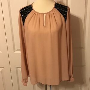 Blush and black blouse
